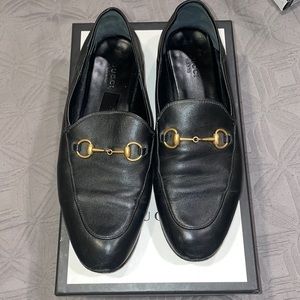 Black and gold Gucci loafers with box